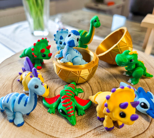 Bunte Überraschungs-Dinos im goldenen Ei - Sammelfigur